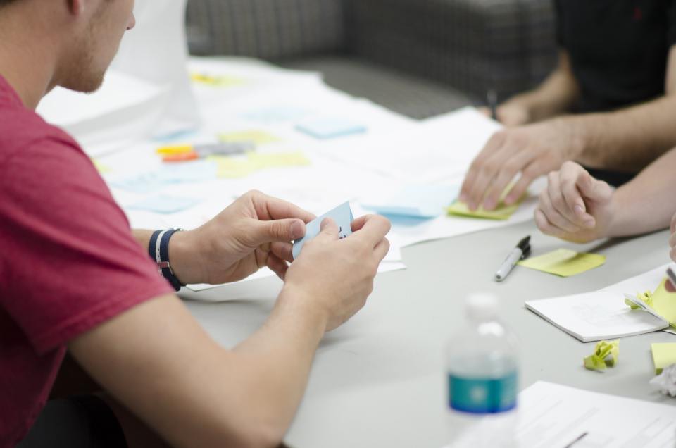 A team planning a campaign with sticky notes